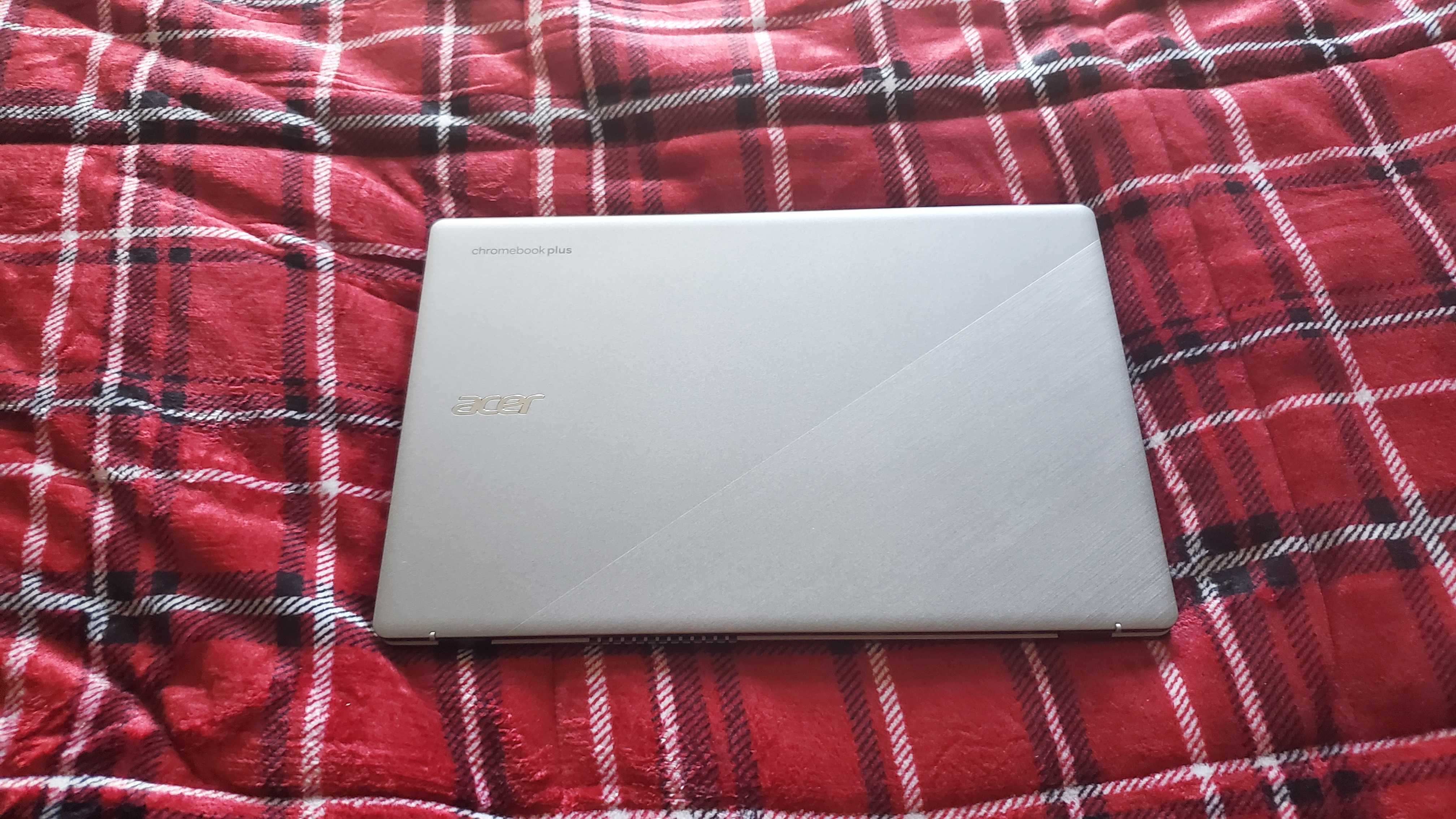 chromebook plus laptop sitting on bed