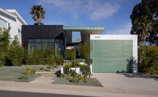 Front facade on sunny day at Mar Vista Residence by Tim Gorter Architect