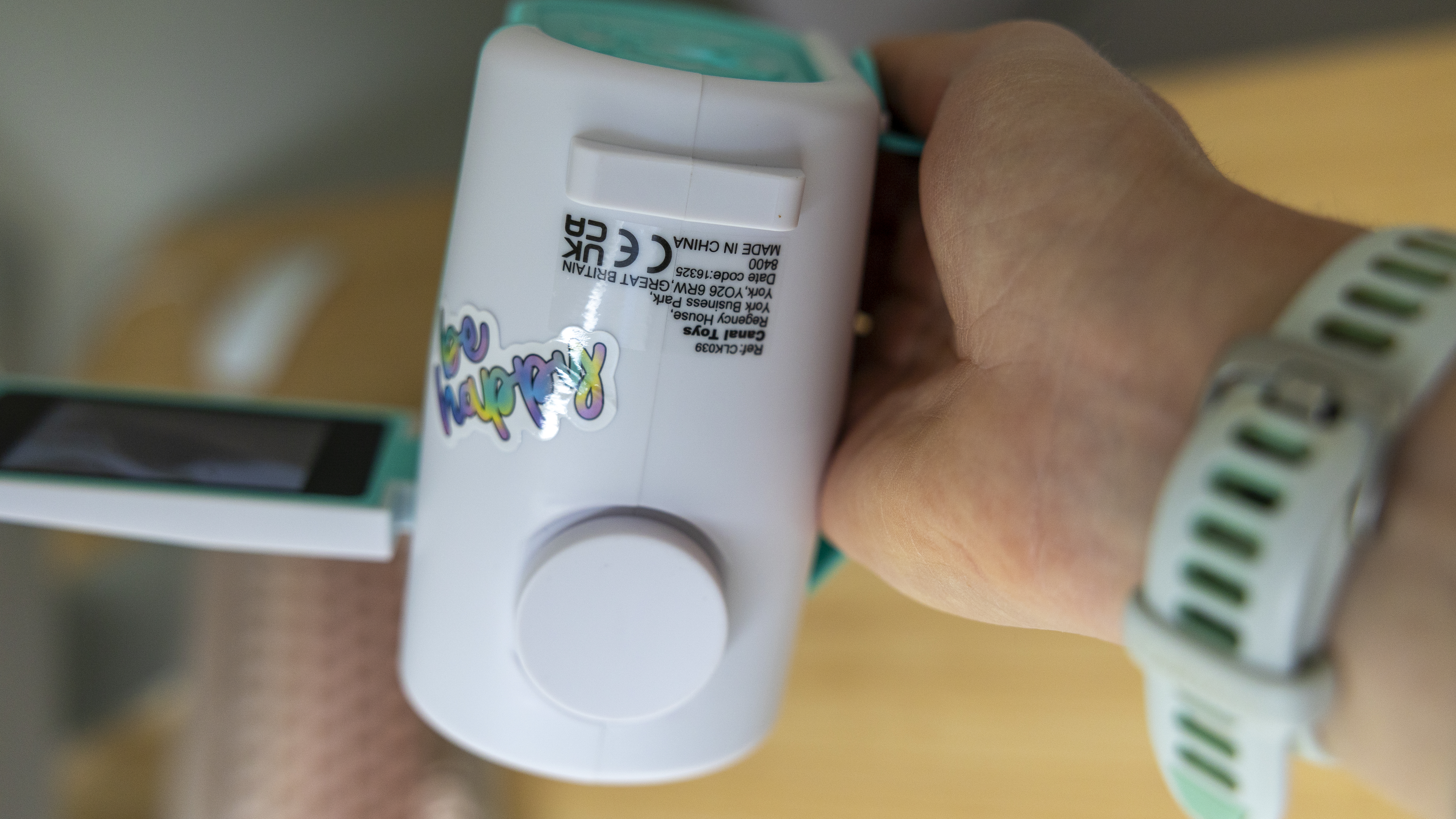 The Photo Creator projector video camera being handled in a home office