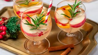 Apple fizz in glasses with rosemary and apple slices