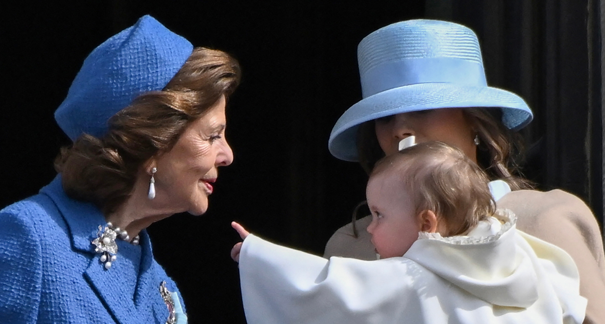 Queen Silvia looking at Princess Ines