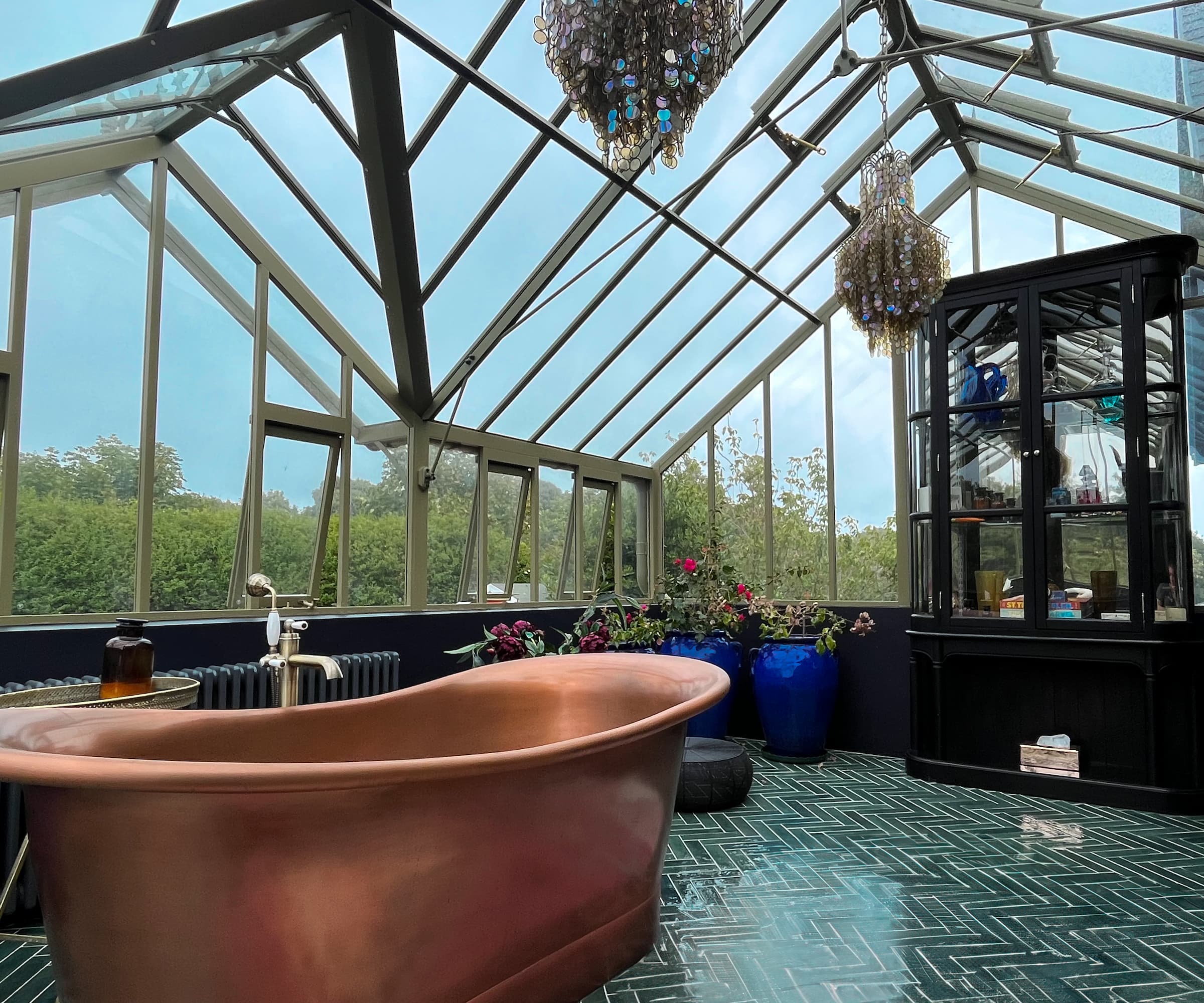 A brass bath in a greenhouse