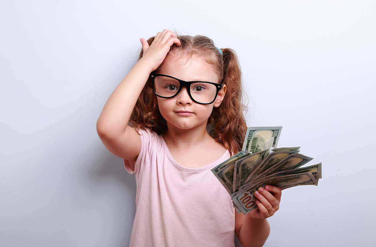 photo illustration of confused child holding money