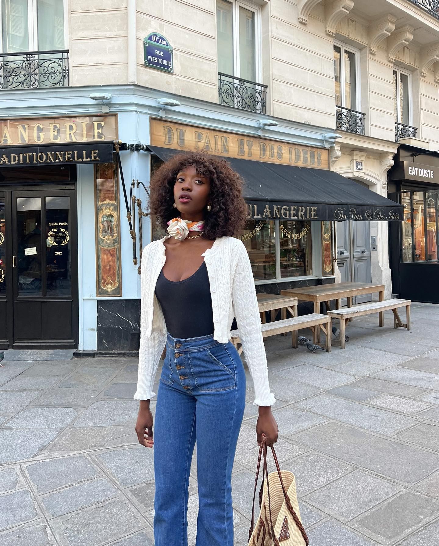 Influencer styles a pointelle knit cardigan.
