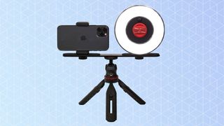 The Rotolight Ultimate Vlogging Kit, one of the best ringlights, on a blue background
