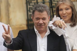 Colombia's President Juan Manuel Santos, with wife Maria Clemencia Rodriguez, after voting in the referendum on a peace accord to end the civil war between the government and the FARC guerrillas, on Oct. 2, 2016.