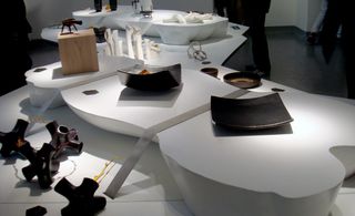 A selection of pieces displayed on white display tables.