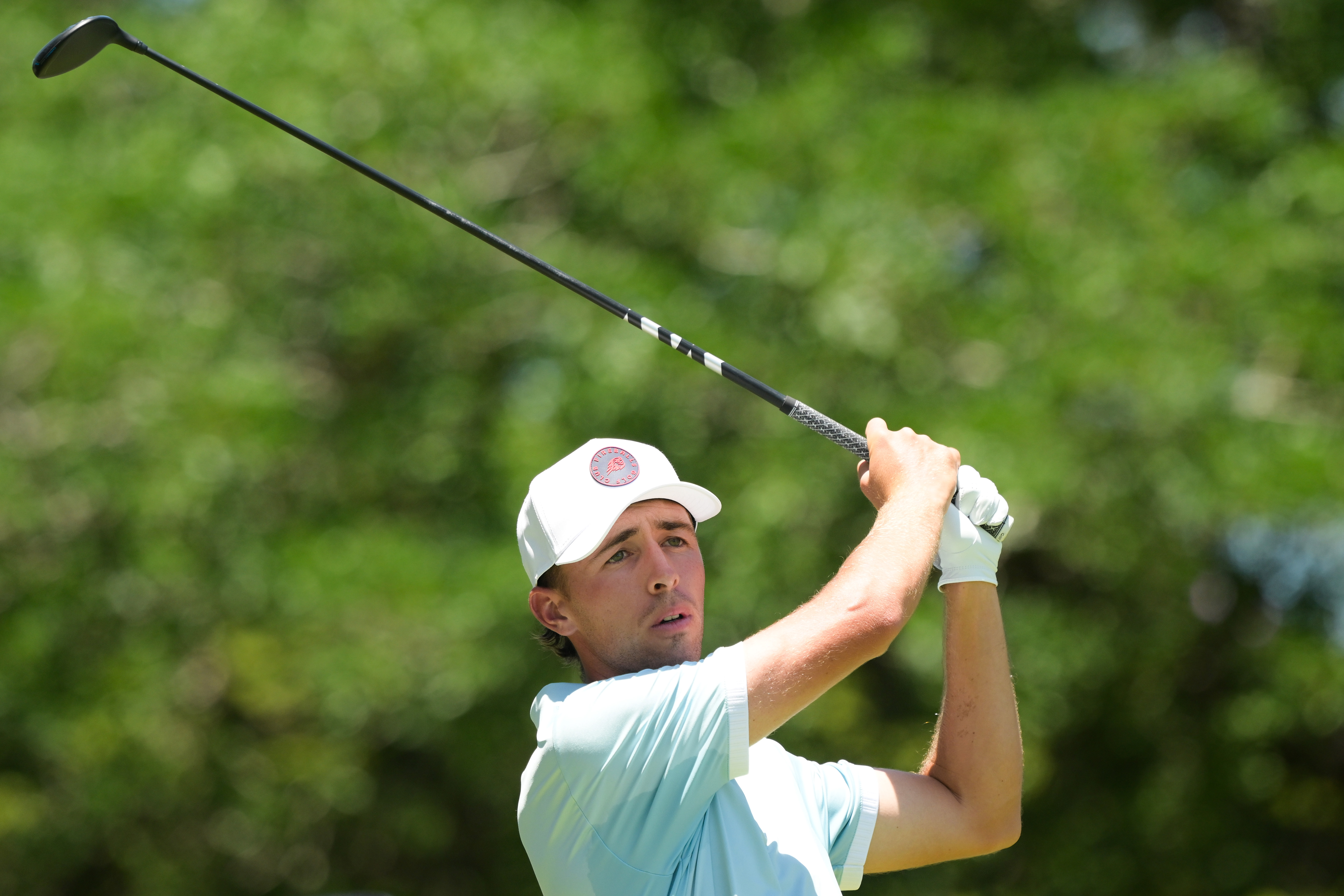 David Puig hits a fairway wood