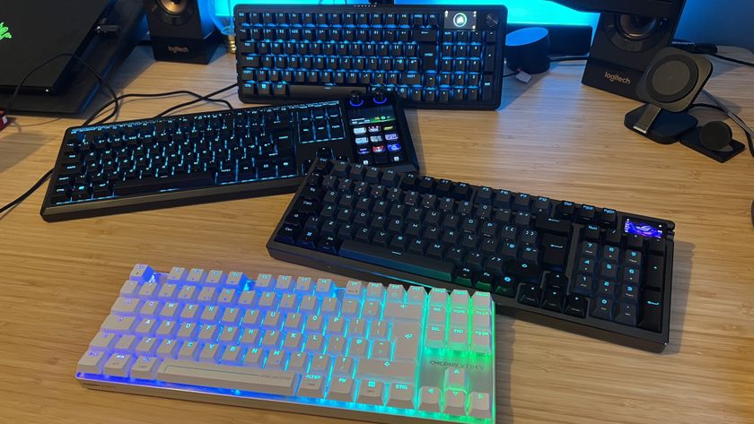 Corsair Vanguard Pro 96, Asus ROG Azoth 96 HE, Corsair Galleon 100 SD and Cherry MX 8.2 Pro TMR TKL on a wooden desk