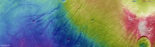 This color-coded topographic image shows Nectaris Fossae and Protva Valles on Mars.