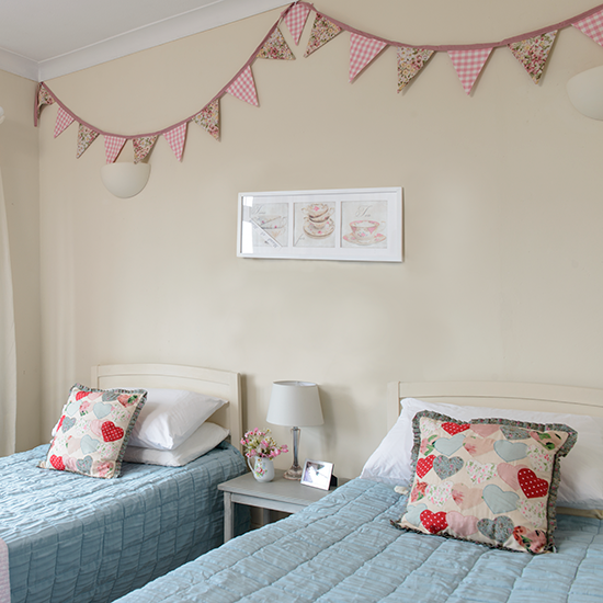 sparee bed room with twwo beds and pillows