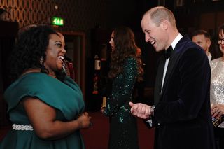 Prince William, Duke of Cambridge (R) speaks with British comedian Judi Love (L) after the Royal Variety Performance at the Royal Albert Hall