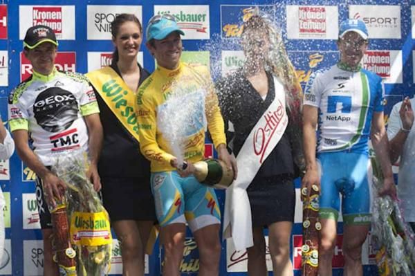 Race winner Fredrik Kessiakoff lets fly with the champagne