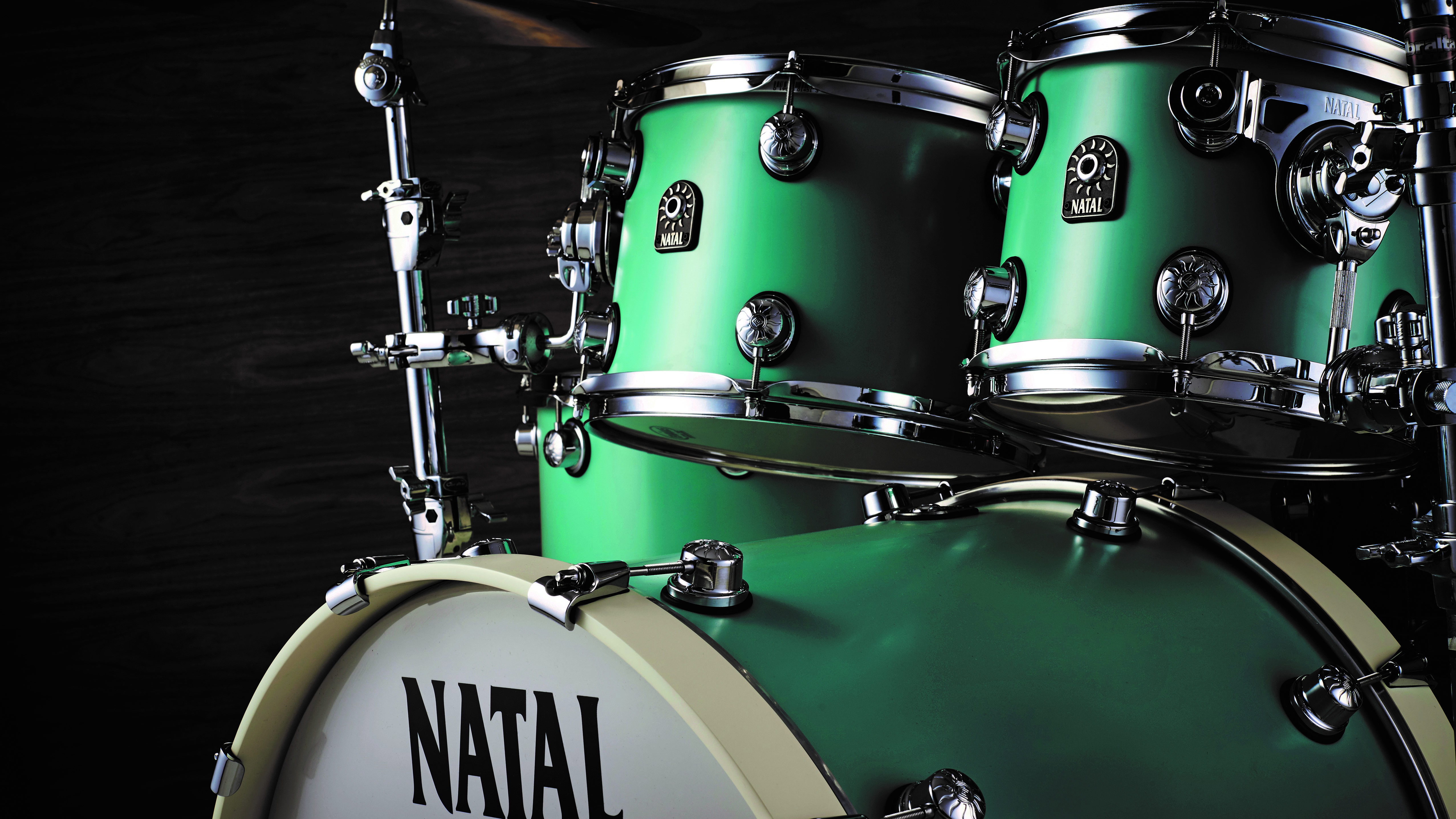 Close-up of Natal Cafe Racer toms and bass drum in green finish