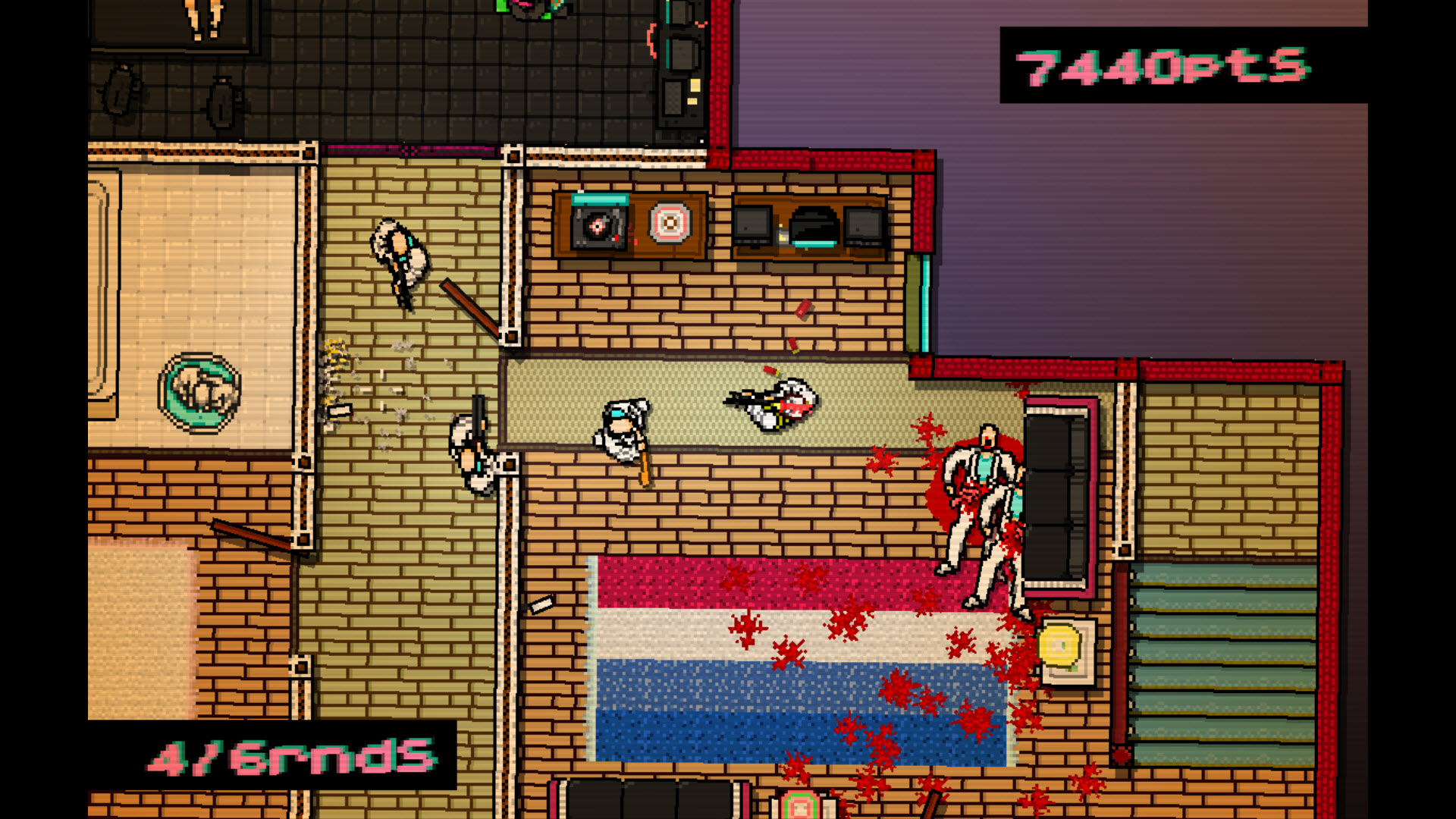 En skärmbild från Hotline Miami som visar en blodig scen inuti en byggnad.