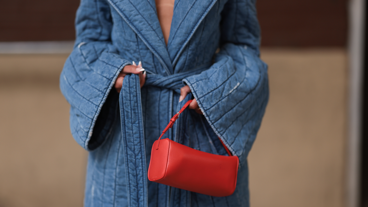 Woman at Fashion Week wearing ombre french nails 