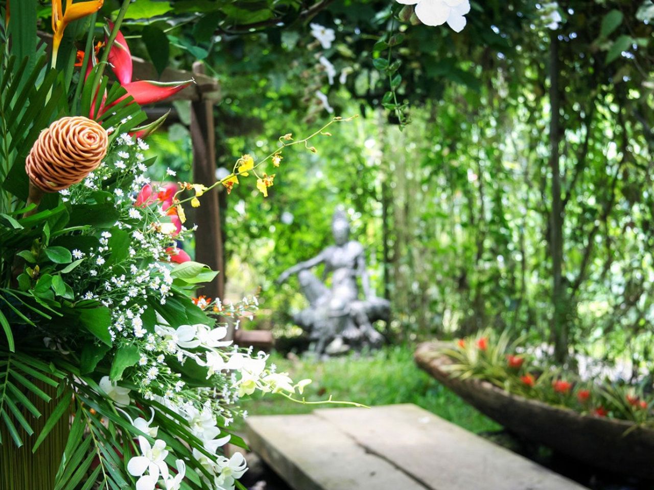 Philippine Style Garden With Green Plants And Garden Statue