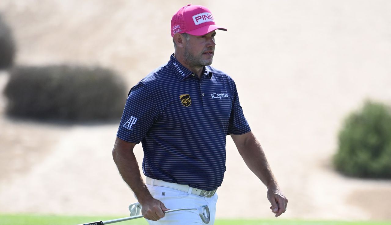 Lee Westwood walks across putting green