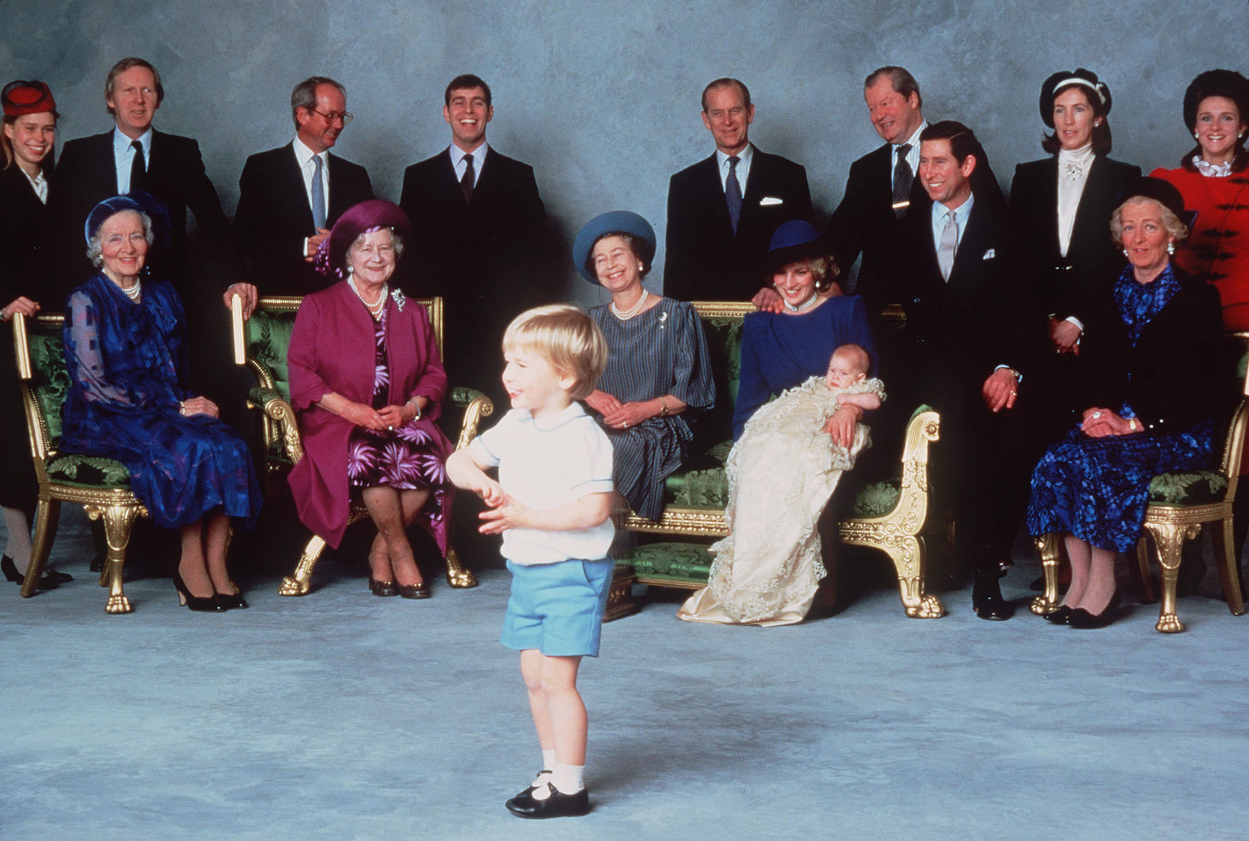 Prince William entertaining a group of royalty posed for pictures at Prince Harry&#039;s christening