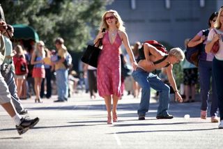 elle walks through the street in a pink dress in Legally Blonde (2001)