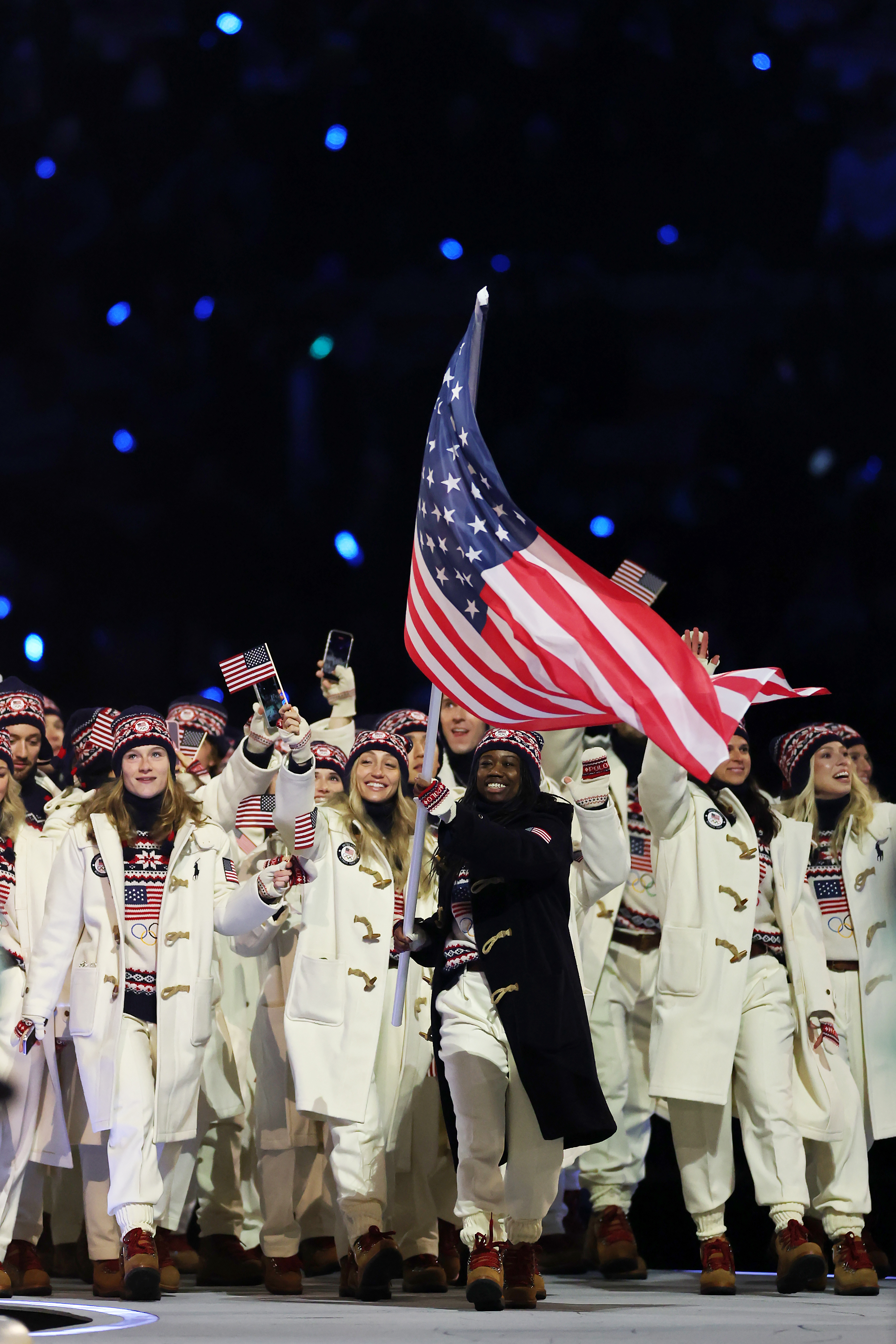 MILAN, ITALY - FEBRUARY 06: Flagbearer Erin Jackson of Team United States leads the team in the athletes' parade during the opening ceremony of the Milano Cortina 2026 Winter Olympics at San Siro Stadium on February 06, 2026 in Milan, Italy.