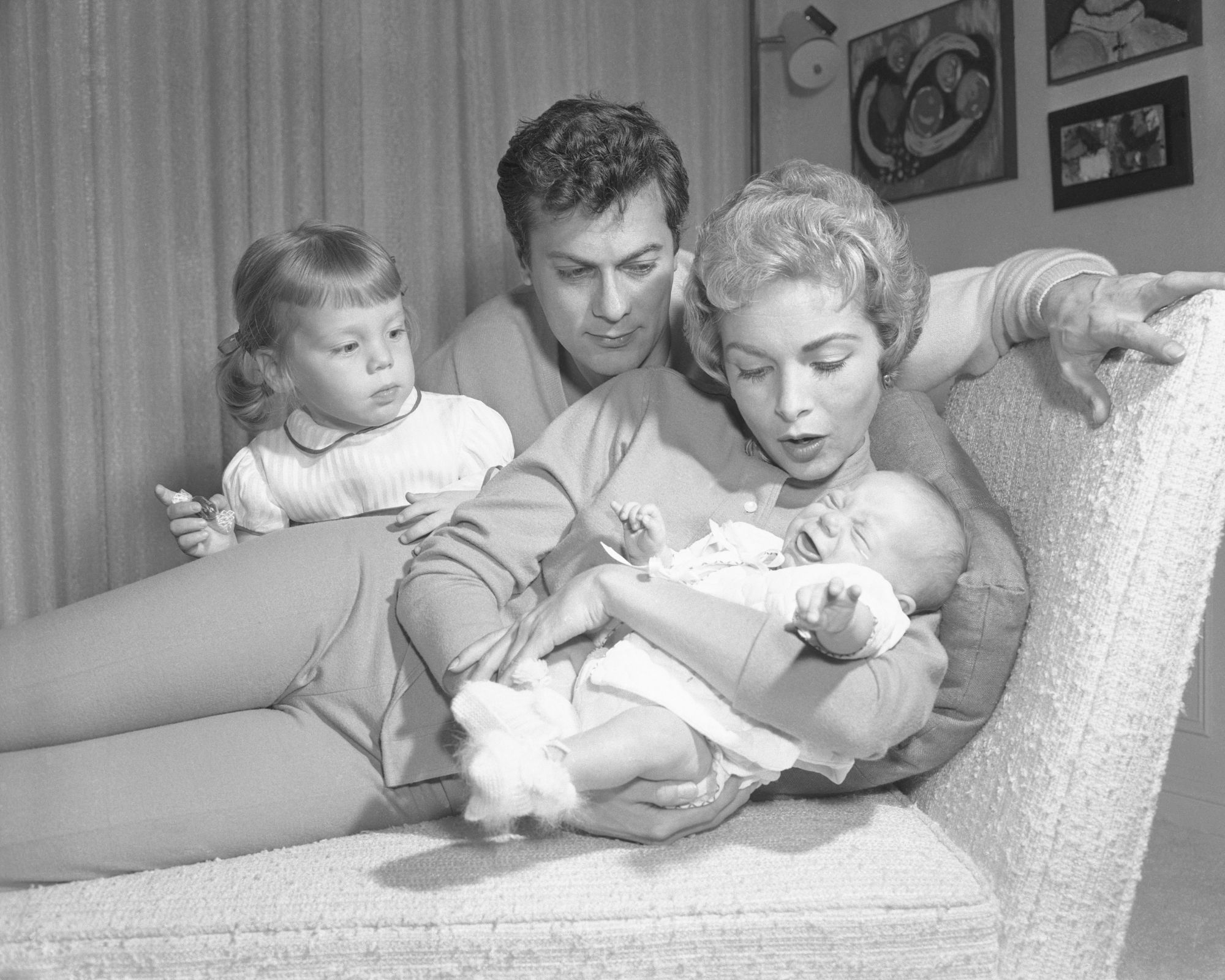 janet leigh and tony curtis holding a baby jamie lee curtis