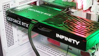 A Palit RTX 5060 Ti Infinity 3 with three fans and 16 GB of memory on a computer.