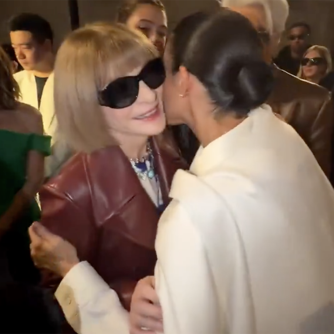 Anna Wintour and Megan Markle greeting each other at Paris Fashion Week.