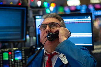 A trader on the New York Stock Exchange as stocks fall
