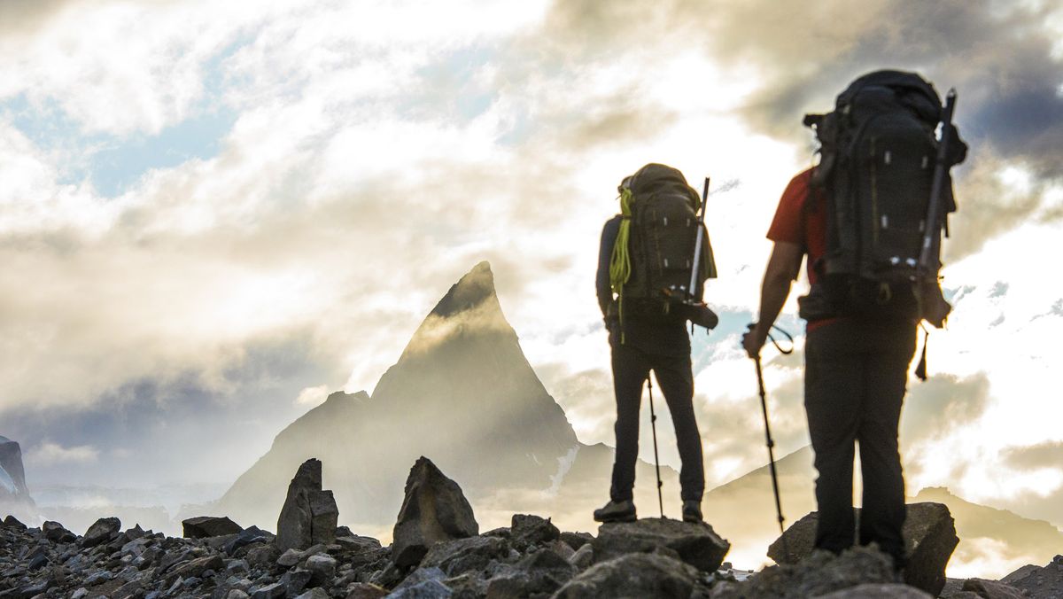 right to roam: two hikers and impressive mountain