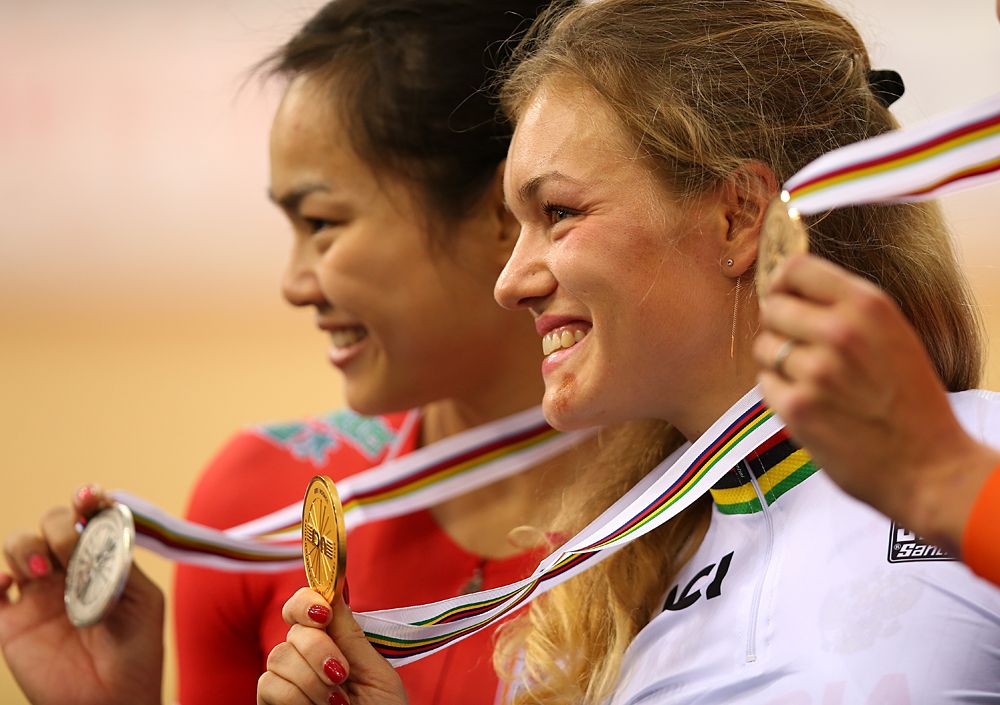 Anastasiia Voinova of Russia celebrates her gold medal after winning The Women's 500m Time Trail