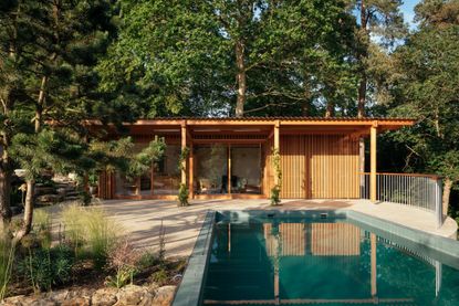 pool house exterior within naturalistic surrey garden