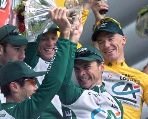 The Credit Agricole team celebrate on the podium