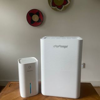 Challenge D015B 12L Dehumidifier sitting next to a smaller dehumidifier