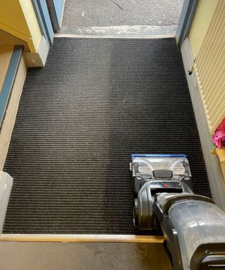 Bissell Revolution HydroSteam cleaning Bristol ARC's entrance barrier matting. You can clearly differentiate the dark wet clean side on the right where I am testing, and the muddy left side yet to be cleaned.