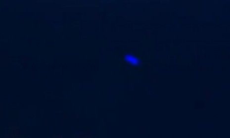 The blue light made erratic back-and-forth movements in the night sky before disappearing, a witness says.