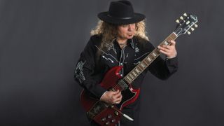 Vinnie Moore plays an Epiphone SG