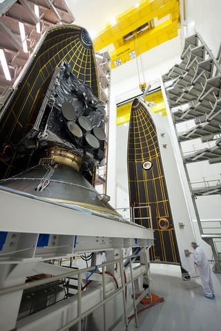 The Air Force's seventh Wideband Global SATCOM (WGS) satellite undergoes encapsulation inside a Delta IV 5-meter payload fairing. Launch is set for July 23, 2015, from Cape Canaveral Air Force Station, Florida.