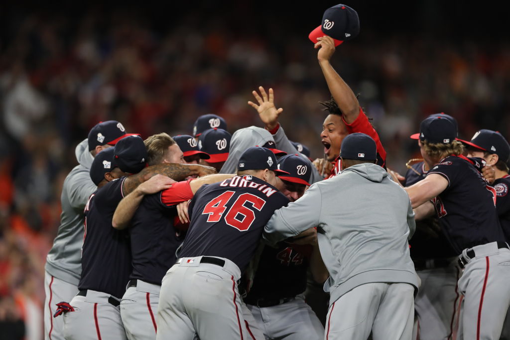 The Washington Nationals celebrate with the trophy after Game 7 of the  baseball World Series against the Houston Astros Wednesday, Oct. 30, 2019,  in Houston. The Nationals won 6-2 to win the