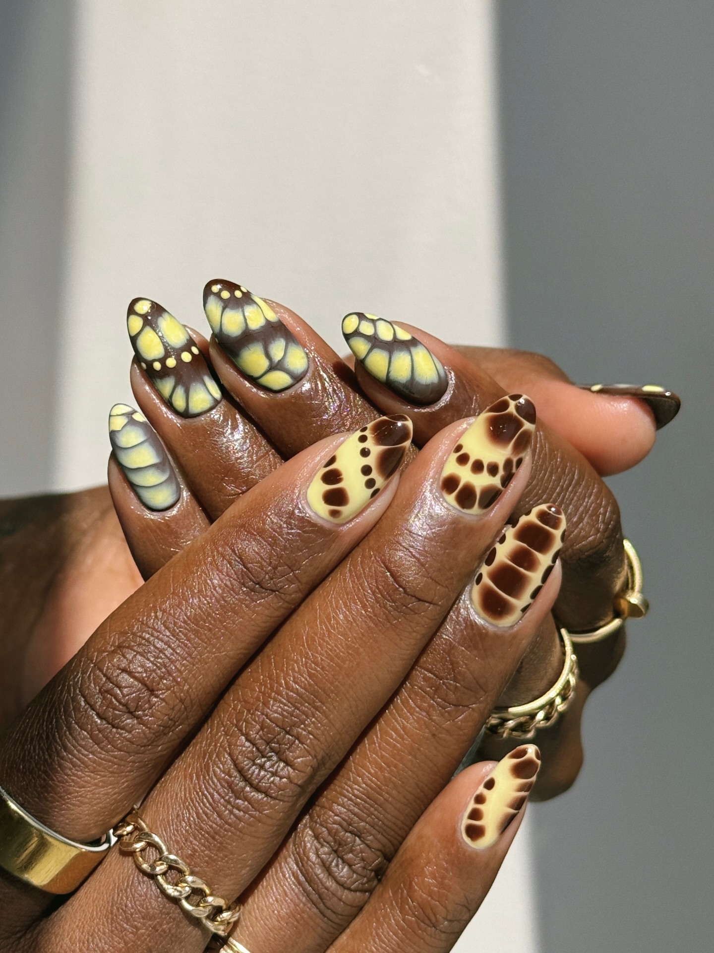 yellow and brown butterfly print nail idea