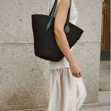 Johannaw wearing white dress and black basket bag