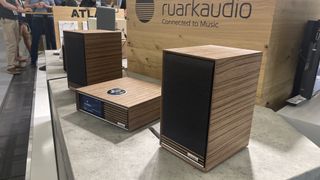 Ruark Audio R610 and Sabre-R bookshelf speakers on show stand display