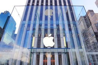 Apple logo on a glass entrace to a skyscraper