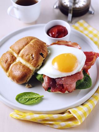 Hot cross buns with eggs, bacon and tomato ketchup