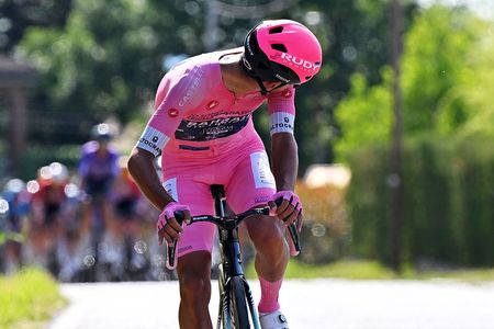Afonso Eulalio in the pink jersey looks back as he sprints for time bonuses on stage 12