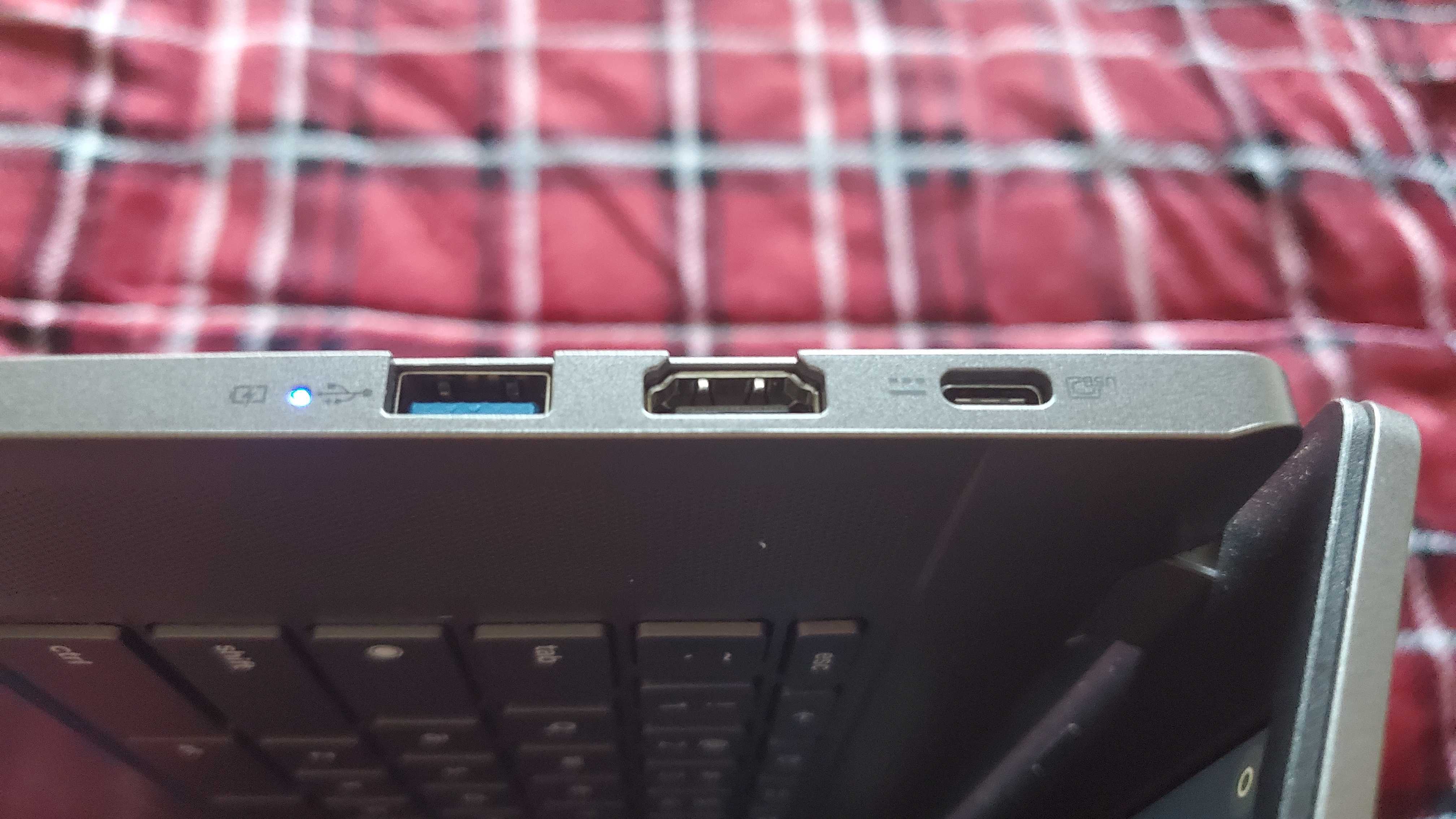 chromebook plus laptop sitting on bed