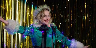 Emilia Clarke covered in Christmas lights in Last Christmas