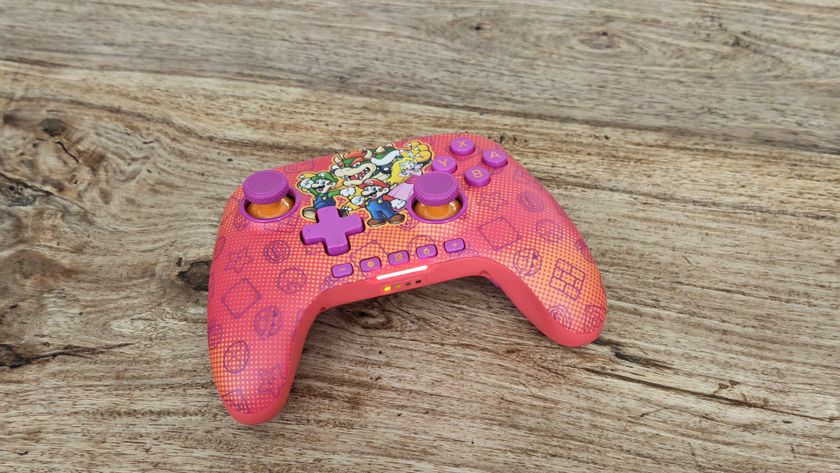 The PowerA Advantage Wireless Controller for Nintendo Switch 2 on a wooden table surface.