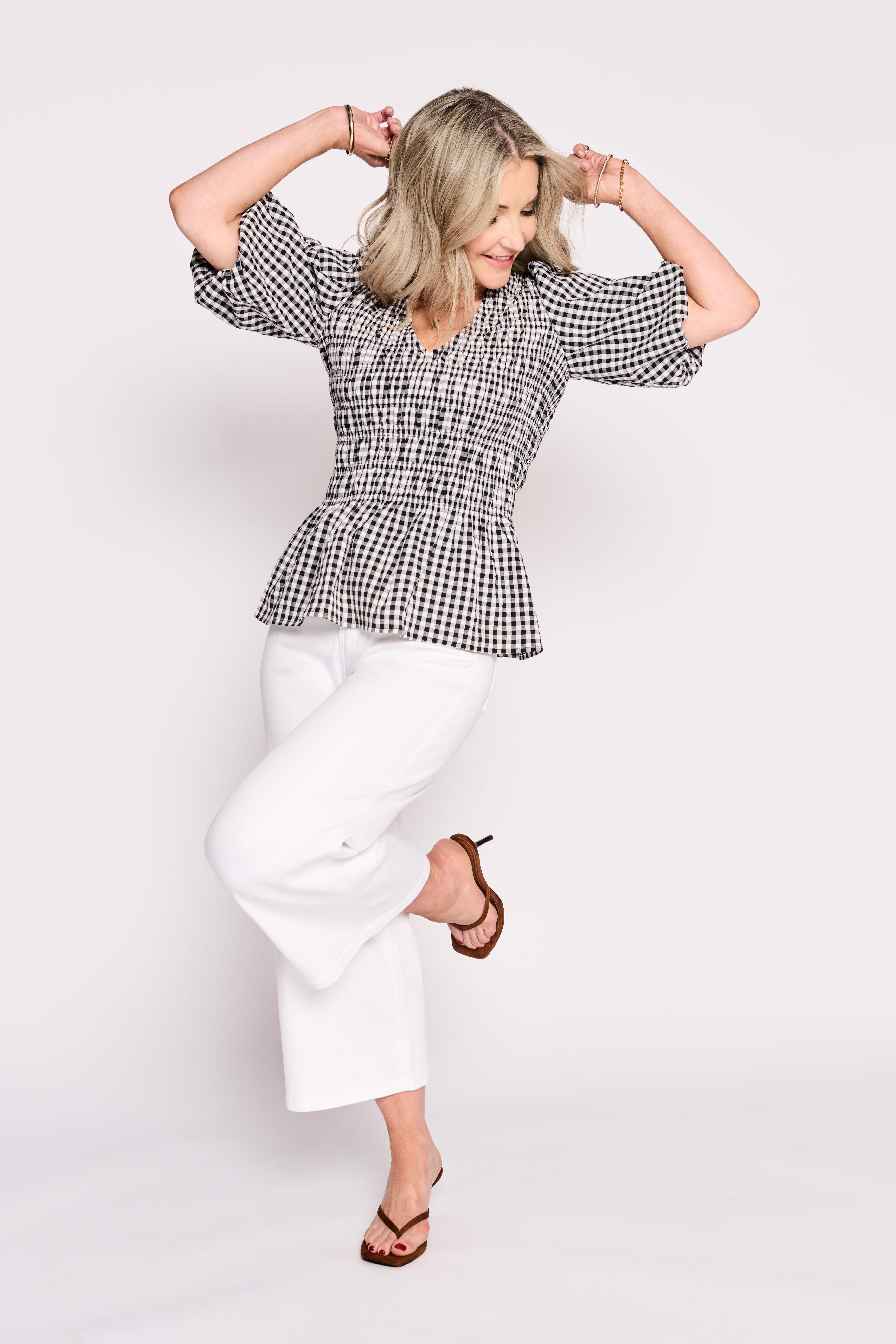 Helen Skelton in check top and white trousers