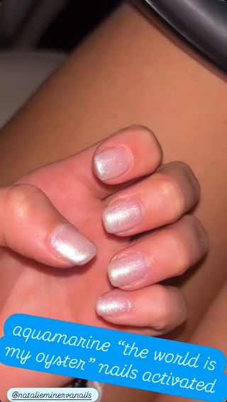 A photo of Addison Rae wearing pearly silver nail polish